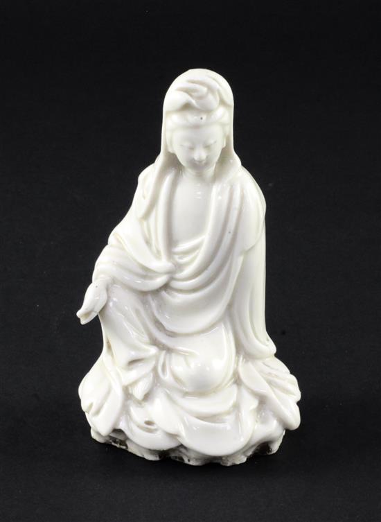 A Chinese blanc de chine seated figure of Guanyin, Dehua, 18th / 19th century, 11cm, losses to fingers